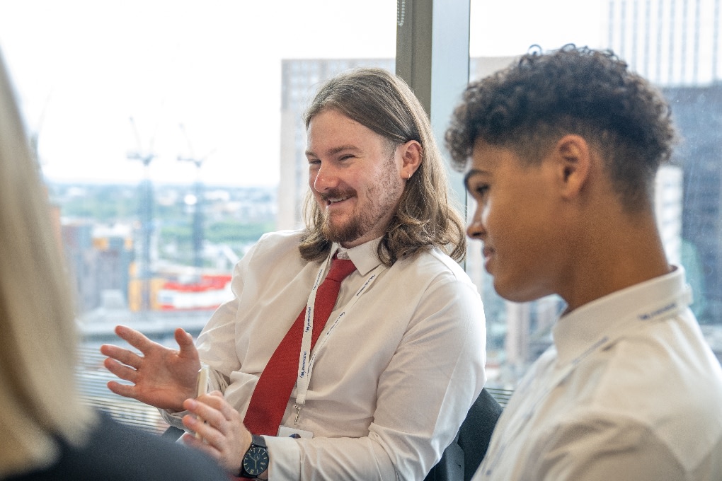 Two apprenticeships talking in a meeting